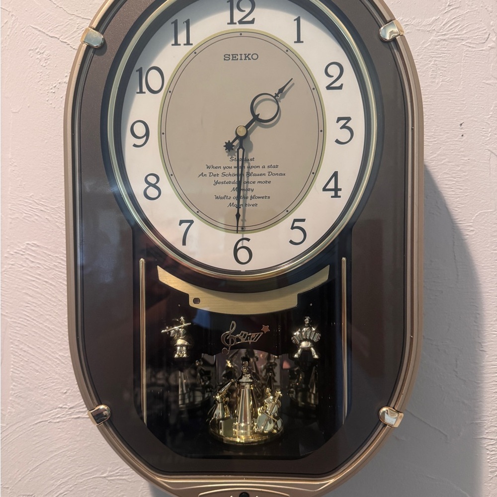 Seiko Elegant Black and Gold Musical Wall Clock